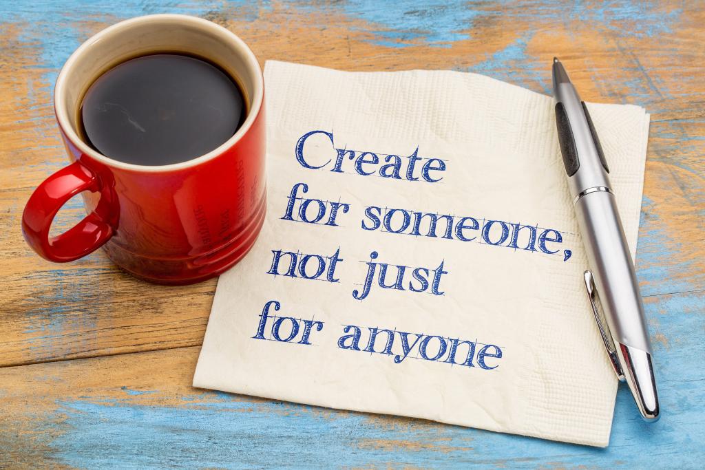 coffee mug next to a napkin with handwritten message - create for someone, not just anyone