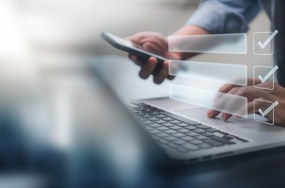 person using a laptop with digital checklist icon for online form concept